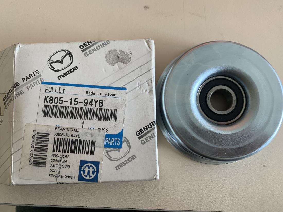 Купити Ролик натяжителя приводного ремня Mazda до Tesla | K8051594YB